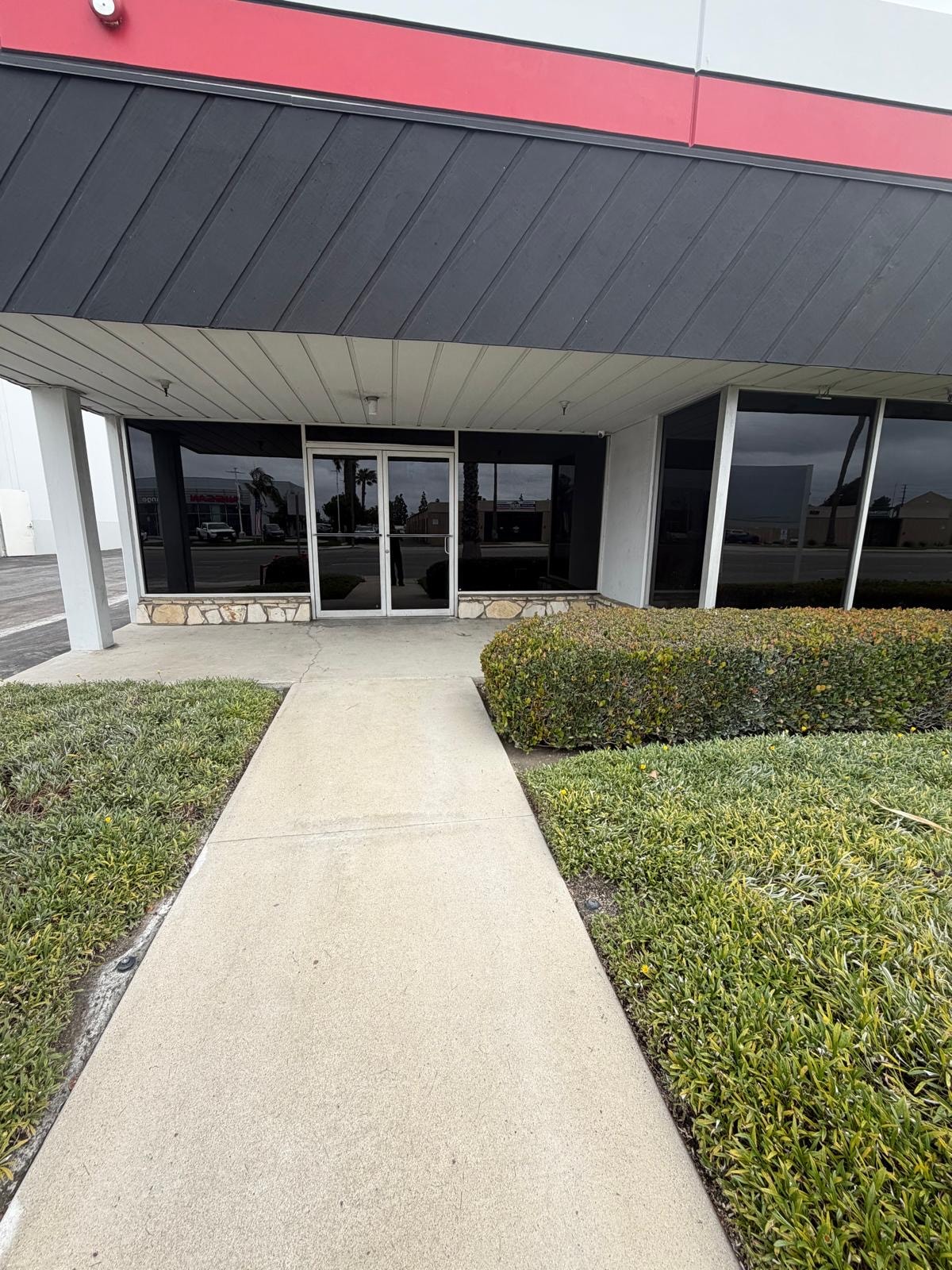 Commercial storefront entrance with newly tinted windows
